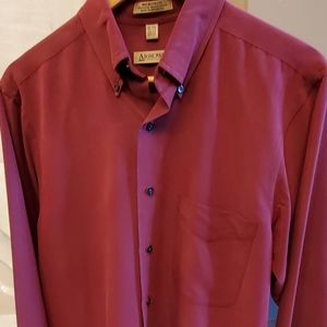 Long-sleeved button down maroon shirt.